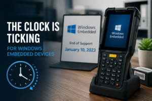 Rugged handheld mobile computer showing Windows Embedded migration concept in an enterprise technology workspace.