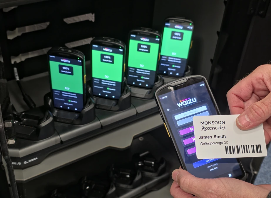 Shared handheld devices at a charging station with staff barcode check-out